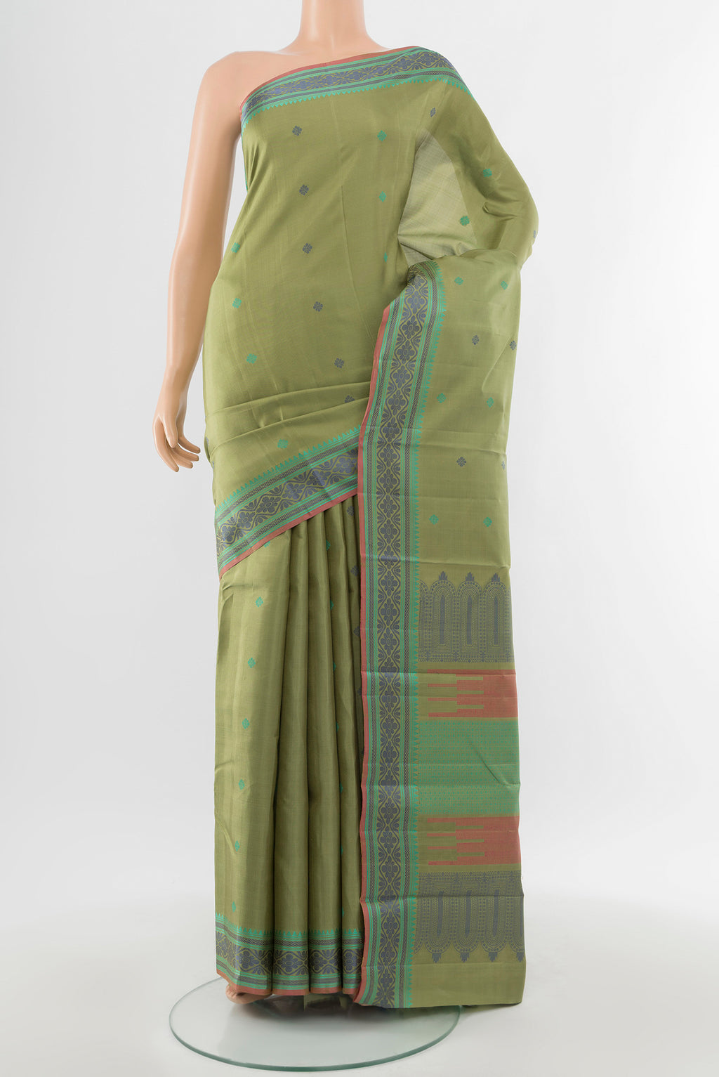 Pure Silk Pure Zari Light Green Kanchipuram Saree with Zari Butta on the body and Silk Border.  displayed on a mannequin