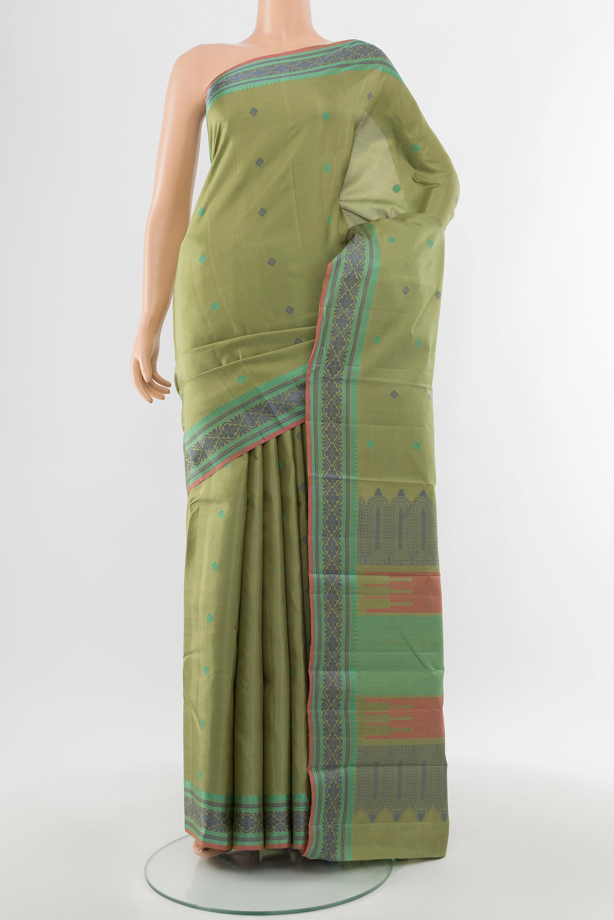 Pure Silk Pure Zari Light Green Kanchipuram Saree with Zari Butta on the body and Silk Border.  displayed on a mannequin