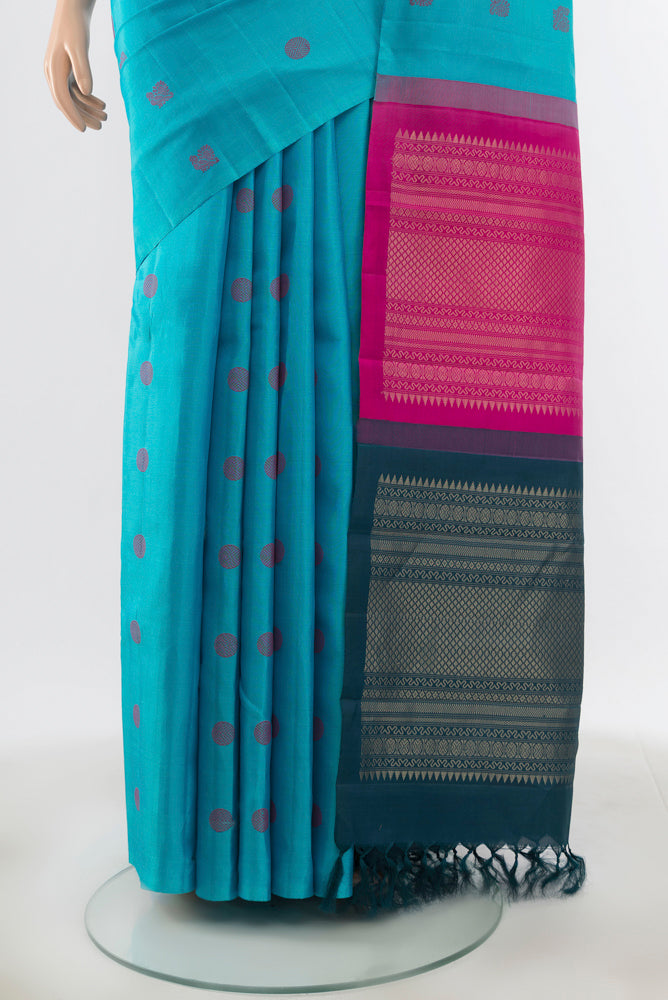Pleats and pallu of Pure Silk Pure Zari Sky Blue Kanchipuram Saree with Zari Butta on the body and Silk Border. 