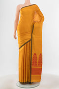 Pure Silk Pure Zari Mustard Kanchipuram Saree with Zari Butta on the body and Silk Border.  displayed on a mannequin