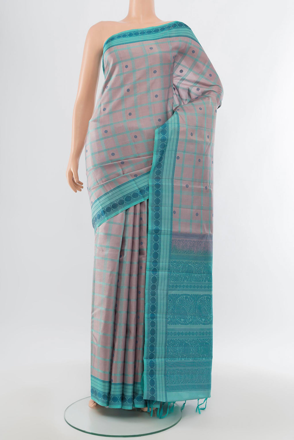 Pure Silk Pure Zari Multi Color Kanchipuram Saree with Zari Butta on the body and Silk Border.  displayed on a mannequin