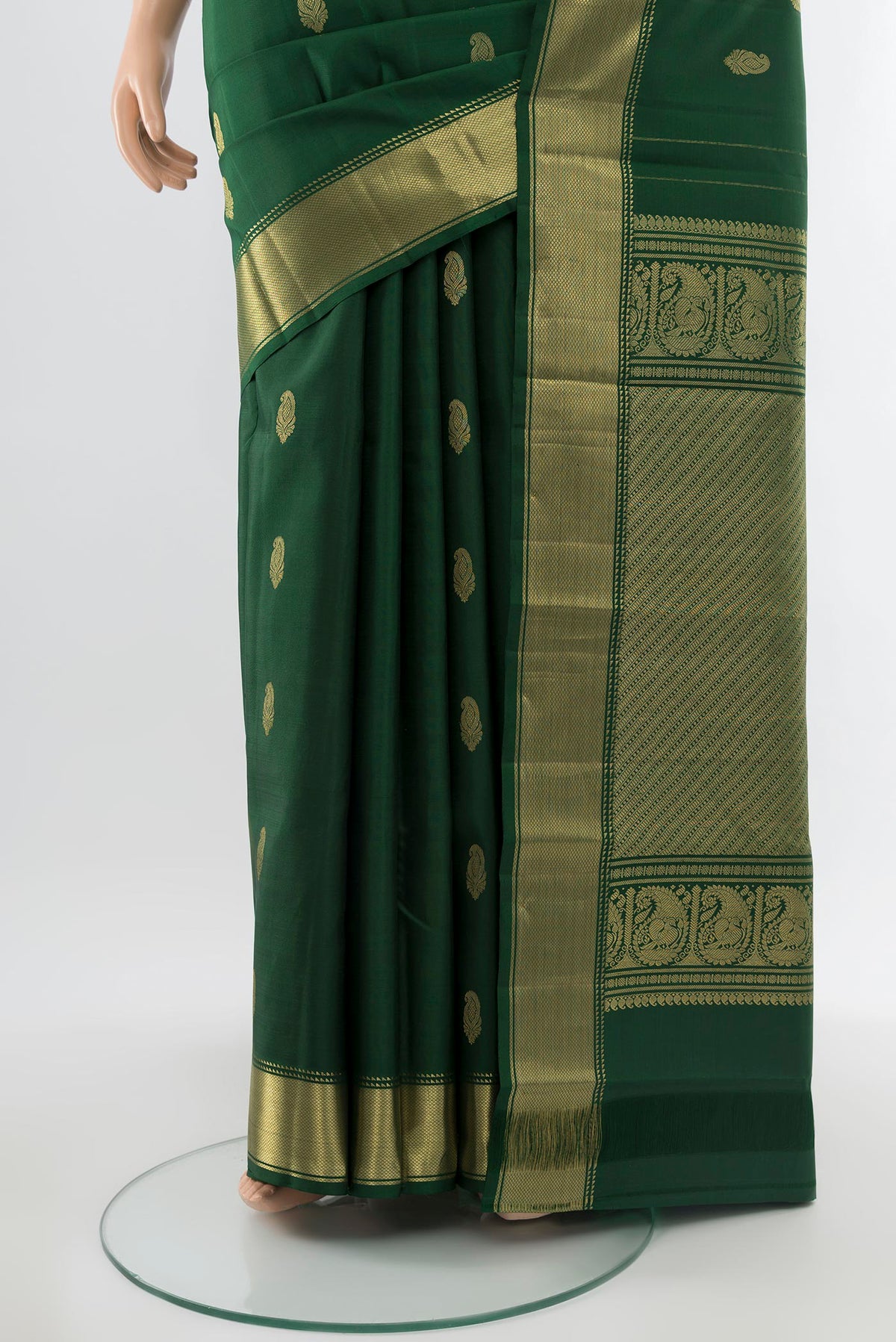 Pleats and pallu of Pure Silk Pure Zari Bottle Green Kanchipuram Saree with Zari Butta on the body and Silk Border. 