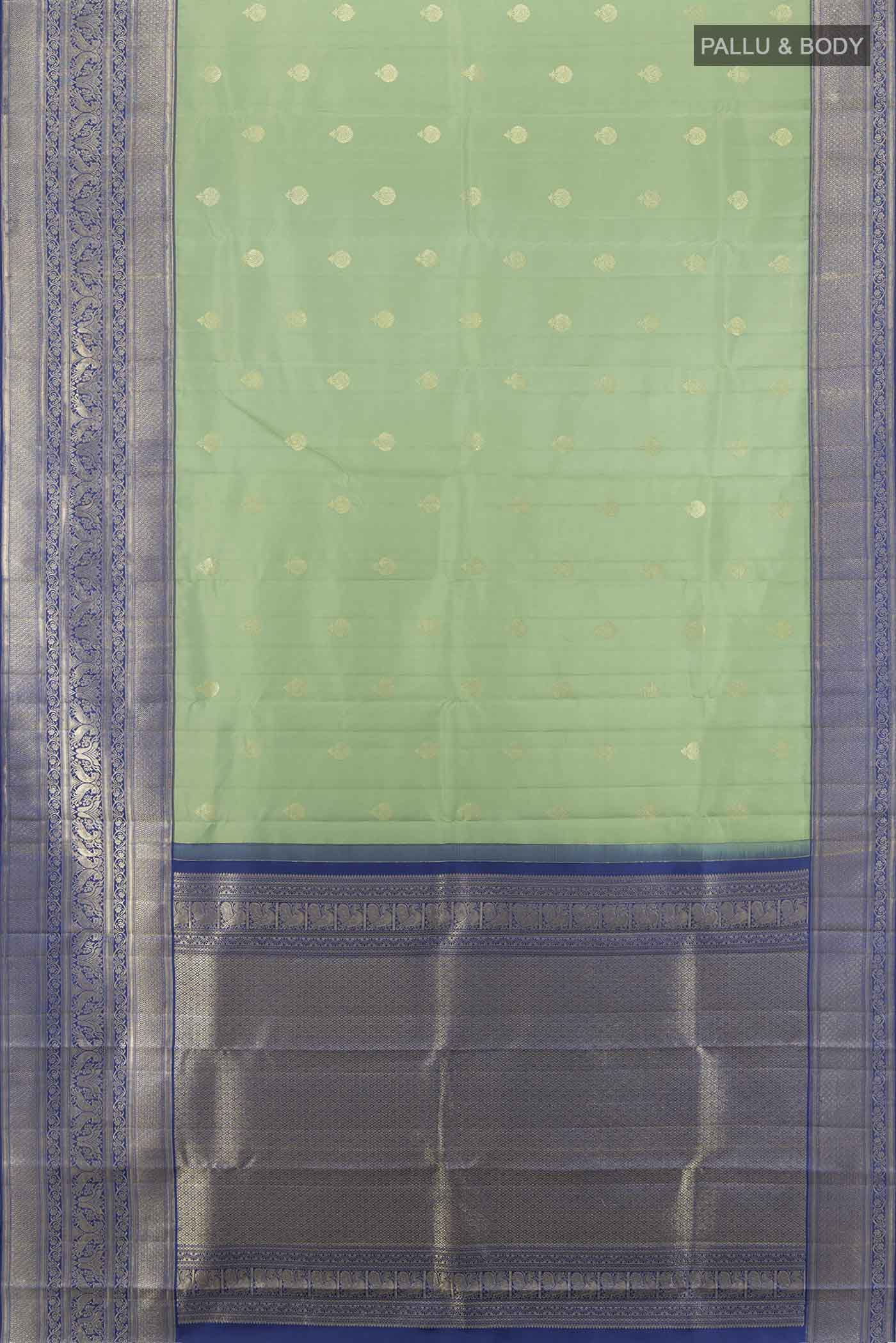 Flat view of Pista Green Kanjivaram Silk Saree with Zari Butta on the body and Silk Border. 