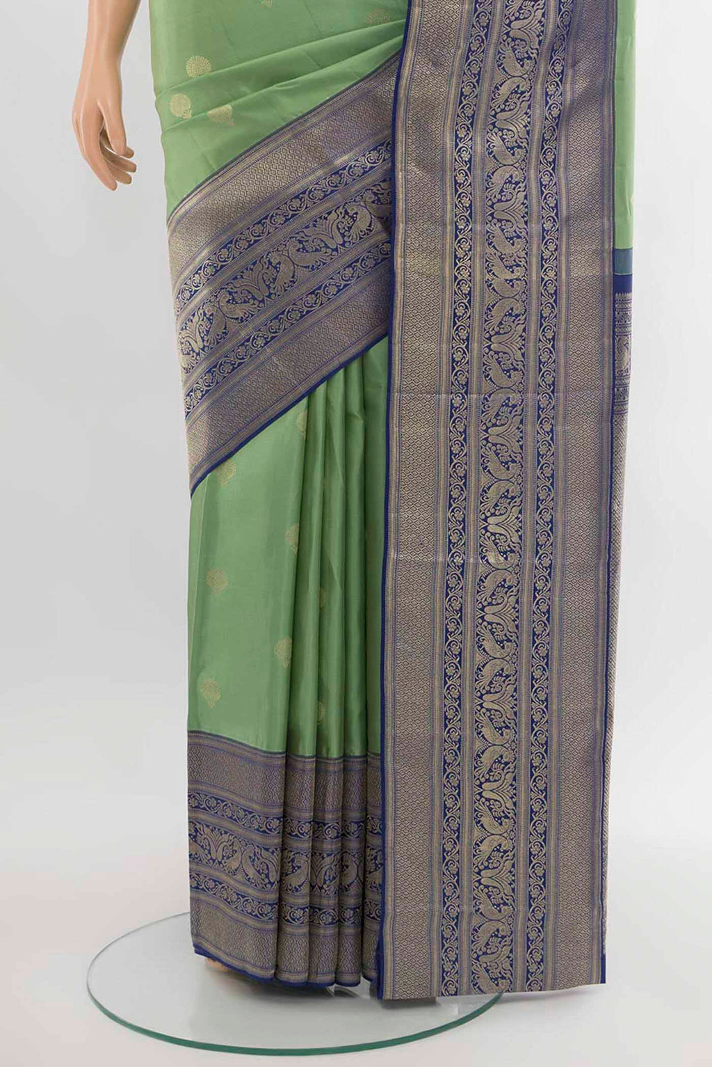 Pleats and pallu of Pista Green Kanjivaram Silk Saree with Zari Butta on the body and Silk Border. 