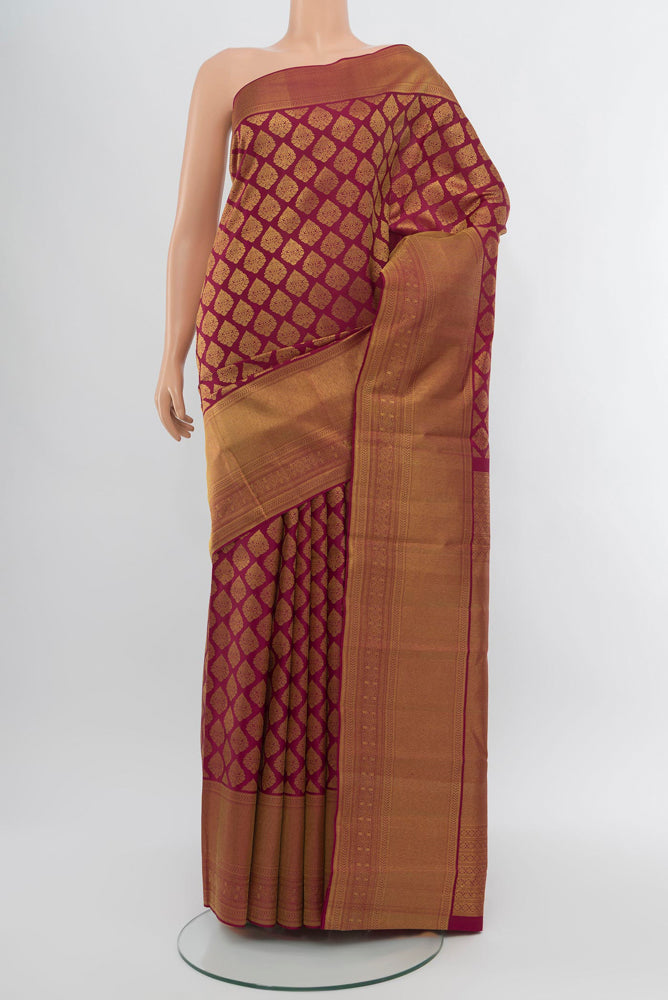 Dark Pink Kanjivaram Silk Saree with Zari Brocade on the body and Zari Border.  displayed on a mannequin