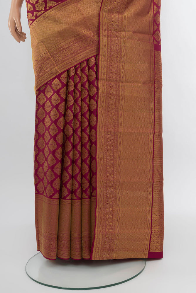 Pleats and pallu of Dark Pink Kanjivaram Silk Saree with Zari Brocade on the body and Zari Border. 