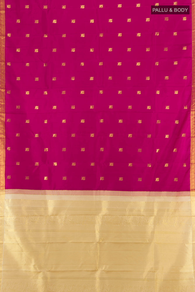 Flat view of Dark Pink Kanchipuram Silk Saree with Zari Butta on the body and Silk Border. 