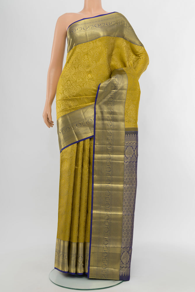 Mehandi Green Kanchipuram Silk Saree with Plain Body and Silk Border.  displayed on a mannequin