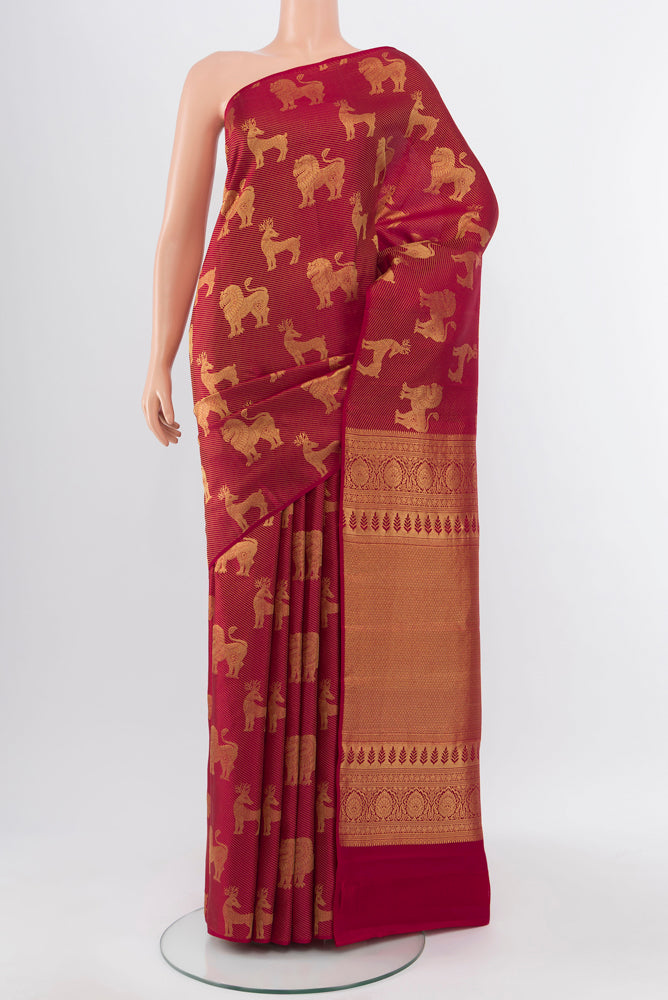 Pure Silk Pure Zari Maroon Kanchipuram Saree with Zari Butta on the body and Silk Border.  displayed on a mannequin