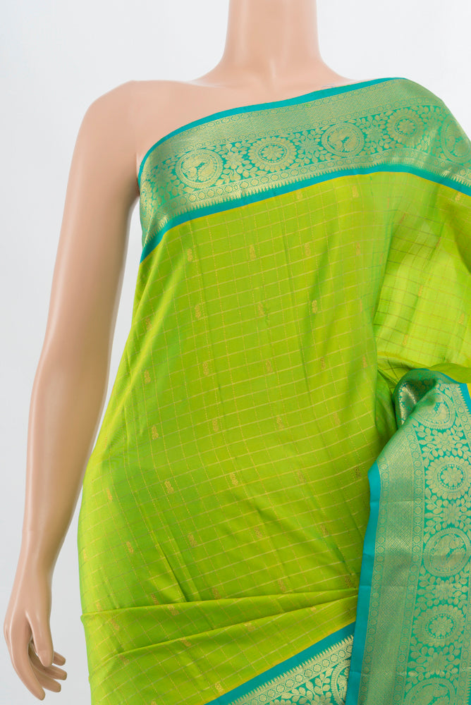 Border image of Parrot Green Kanchipuram Silk Saree with Zari Butta on the body and Silk Border. 