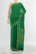 Pure Silk Pure Zari Light Green Kanjivaram Saree with Zari Butta on the body and Silk Border.  displayed on a mannequin