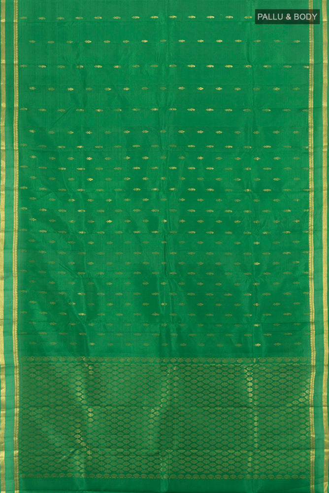 Flat view of Pure Silk Pure Zari Light Green Kanjivaram Saree with Zari Butta on the body and Silk Border. 