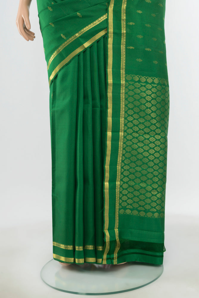 Pleats and pallu of Pure Silk Pure Zari Light Green Kanjivaram Saree with Zari Butta on the body and Silk Border. 