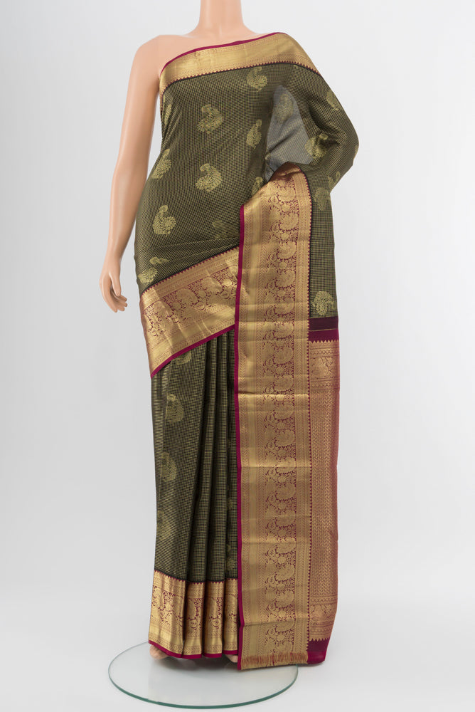 Coffee Brown Kanchipuram Silk Saree with Zari Butta on the body and Silk Border.  displayed on a mannequin