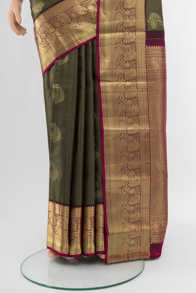 Pleats and pallu of Coffee Brown Kanchipuram Silk Saree with Zari Butta on the body and Silk Border. 