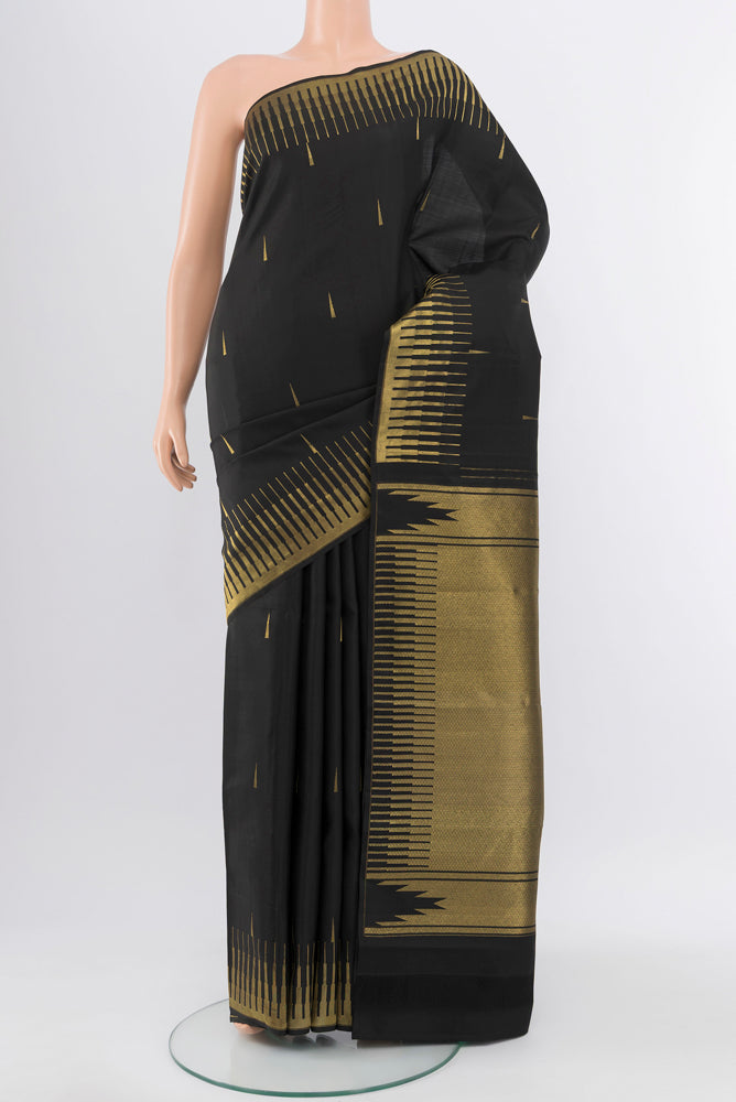 Pure Silk Pure Zari Black Kanchipuram Saree with Zari Butta on the body and Silk Border.  displayed on a mannequin