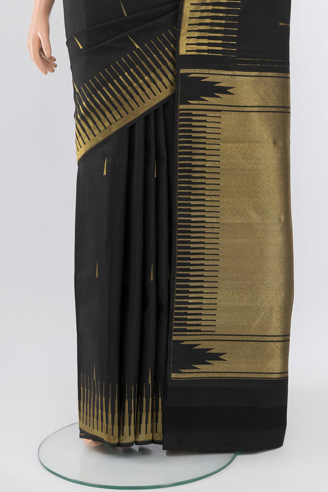 Pleats and pallu of Pure Silk Pure Zari Black Kanchipuram Saree with Zari Butta on the body and Silk Border. 