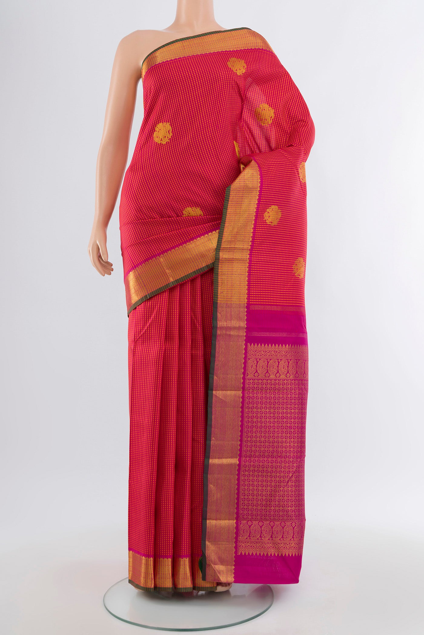 Multi Color Kanjivaram Silk Saree with Zari Butta on the body and Silk Border.  displayed on a mannequin