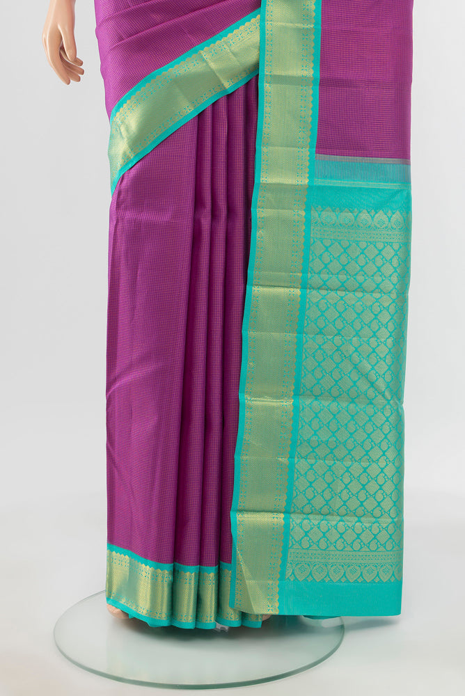 Pleats and pallu of Pure Silk Pure Zari Purple Kanjivaram Saree with Zari Butta on the body and Silk Border. 