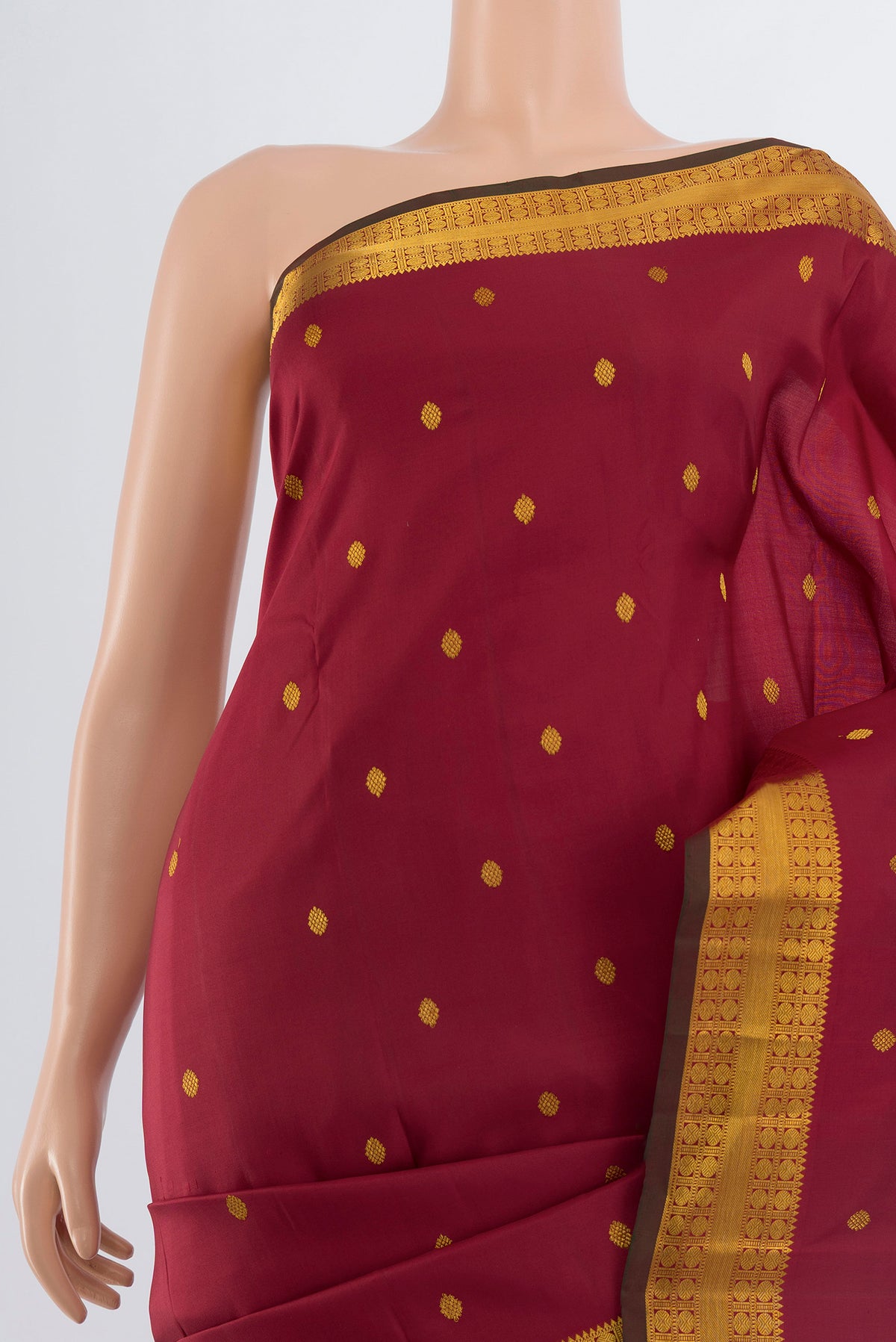 Border image of Maroon Kanchipuram Silk Saree with Zari Butta on the body and Silk Border. 