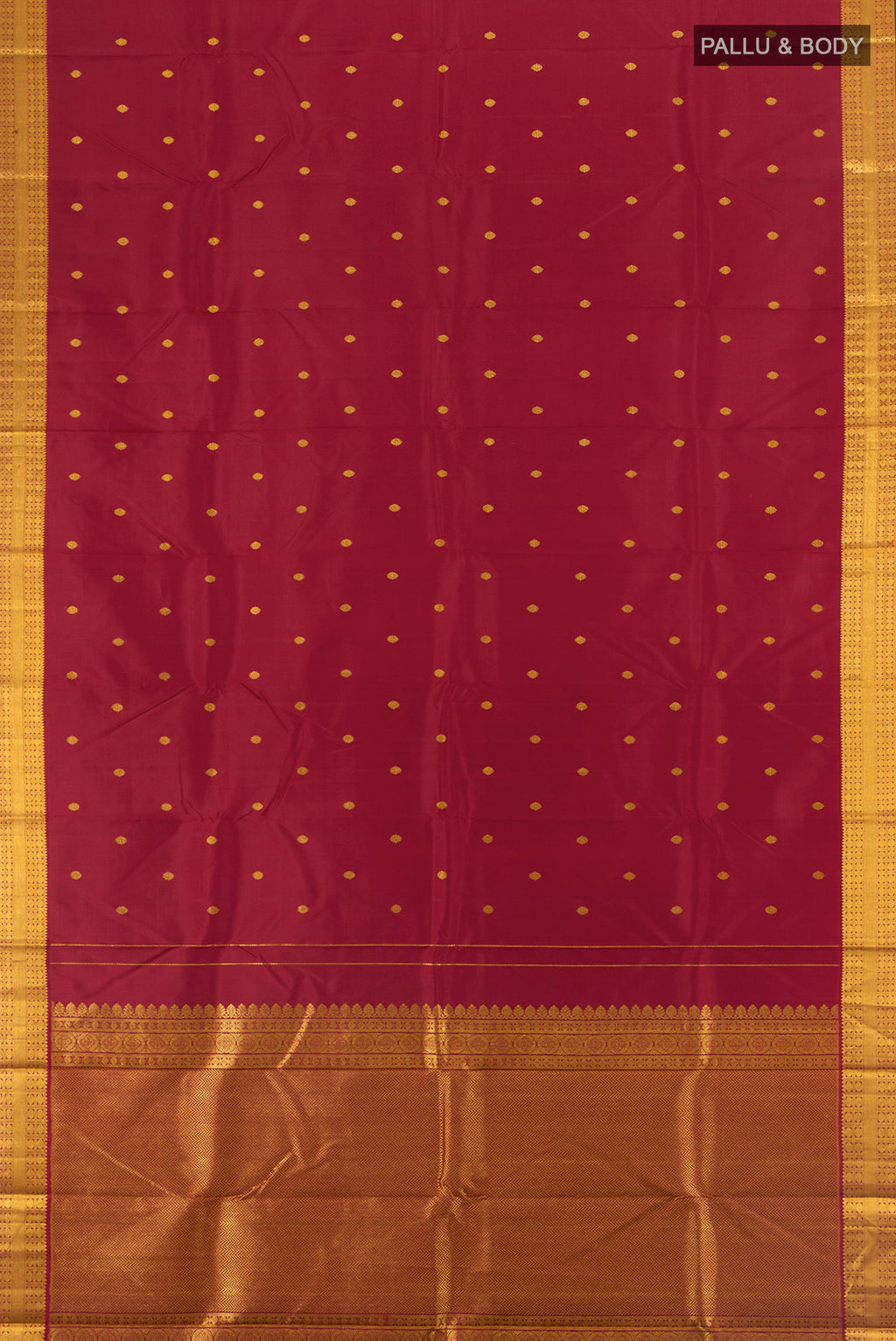 Flat view of Maroon Kanchipuram Silk Saree with Zari Butta on the body and Silk Border. 