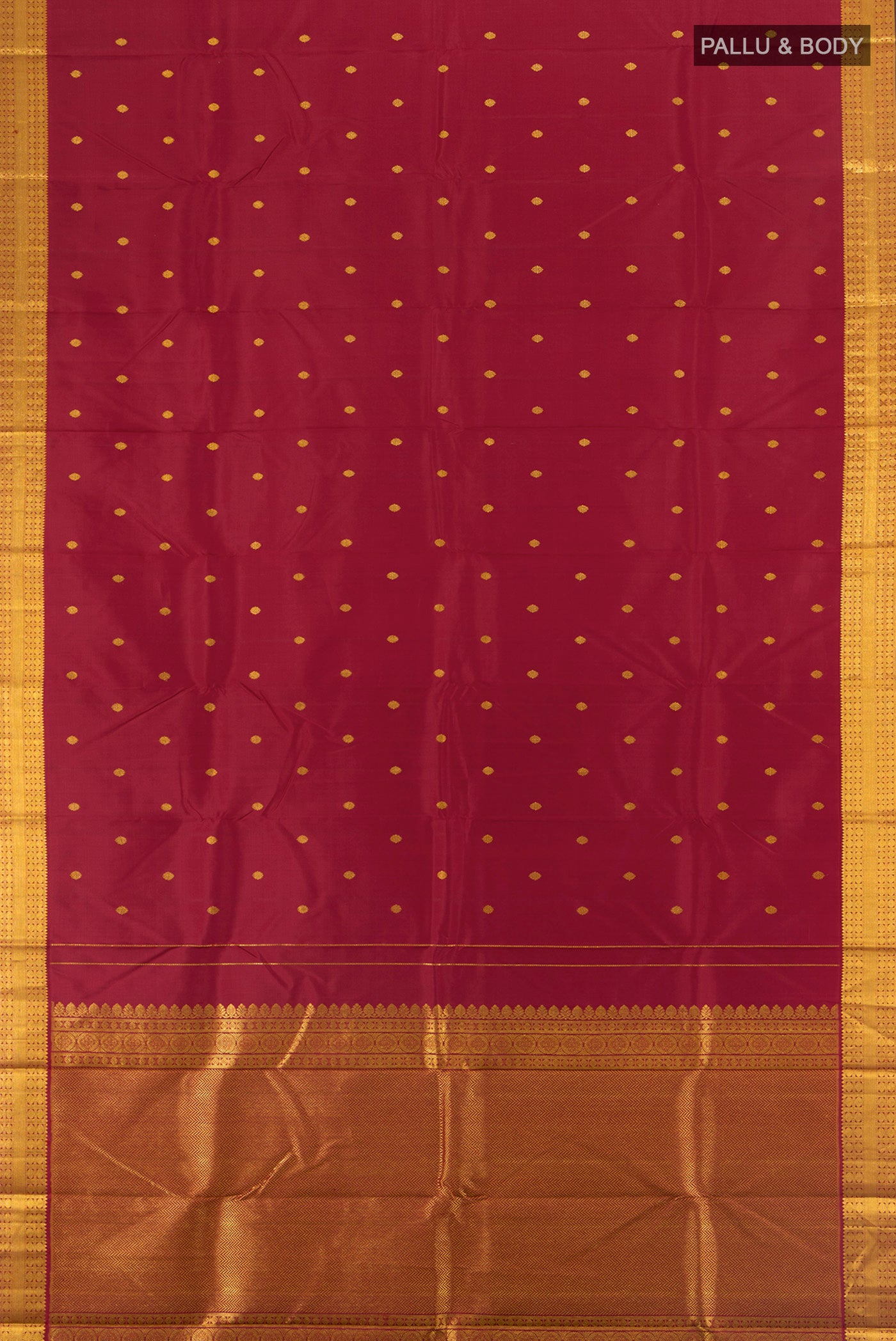 Flat view of Maroon Kanchipuram Silk Saree with Zari Butta on the body and Silk Border. 