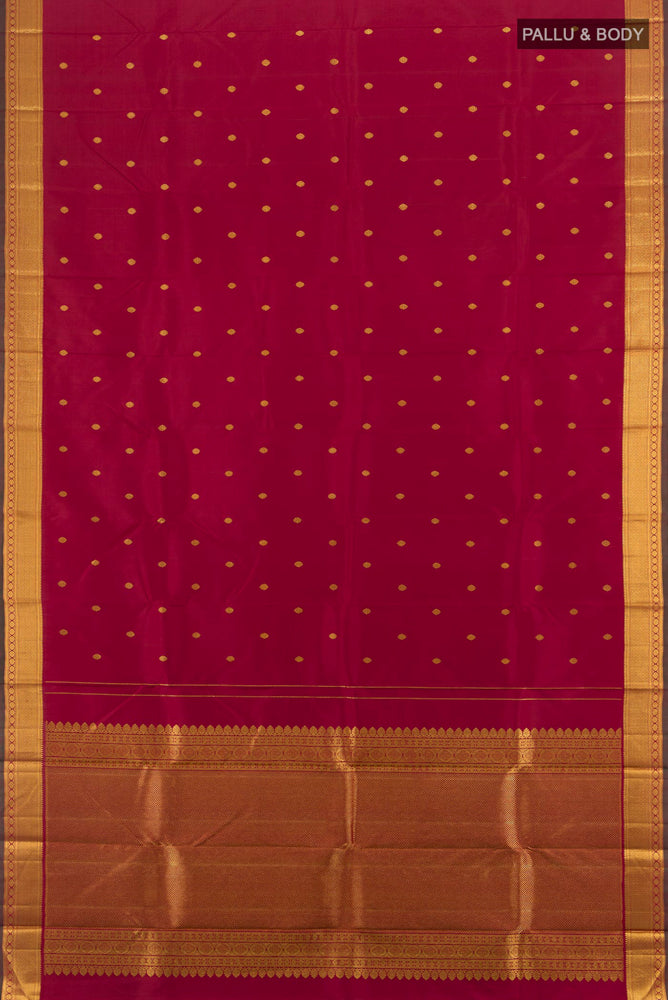 Flat view of Maroon Kanchipuram Silk Saree with Zari Butta on the body and Silk Border. 