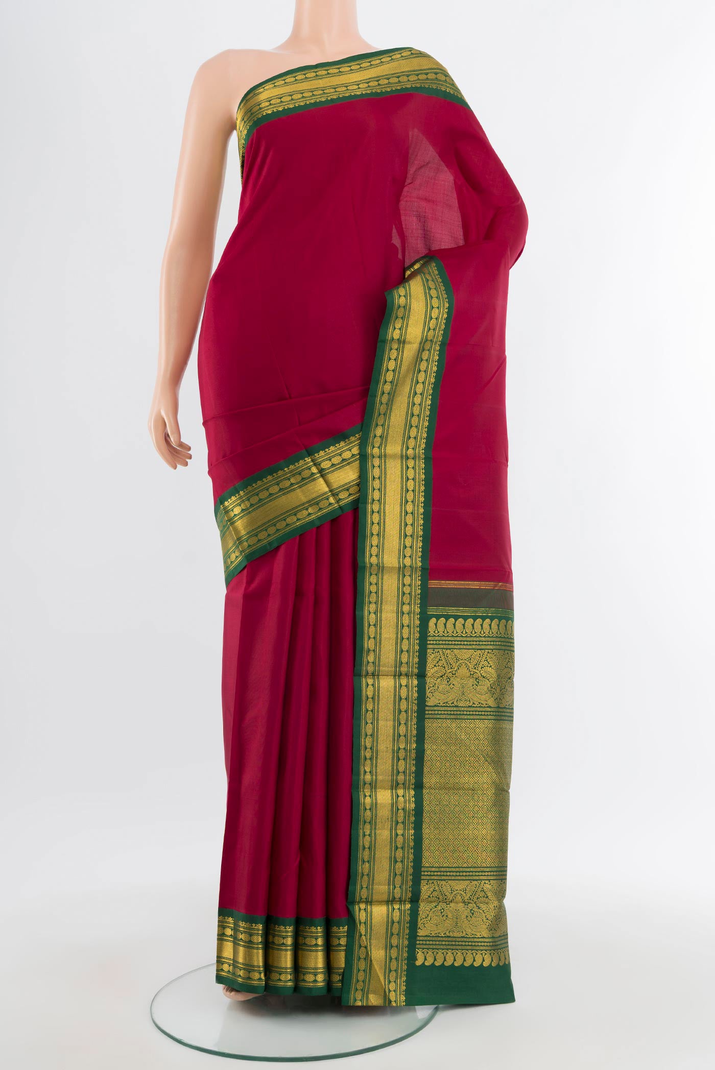 Pure Silk Pure Zari Maroon Kanchipuram Saree with Plain Body and Zari Border.  displayed on a mannequin