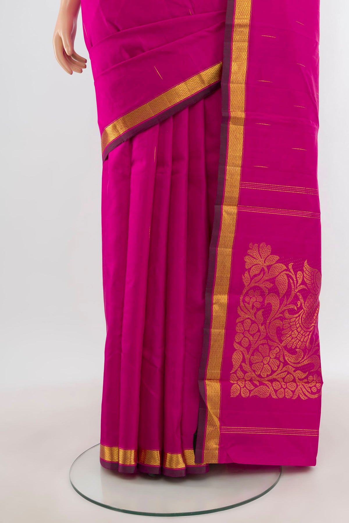 Pleats and pallu of Pure Silk Pure Zari Rani Pink Kanjivaram Saree with Zari Butta on the body and Zari Border. 