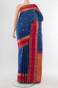 Pure Silk Pure Zari Peacock Blue Kanchipuram Saree with Zari Butta on the body and Silk Border.  displayed on a mannequin