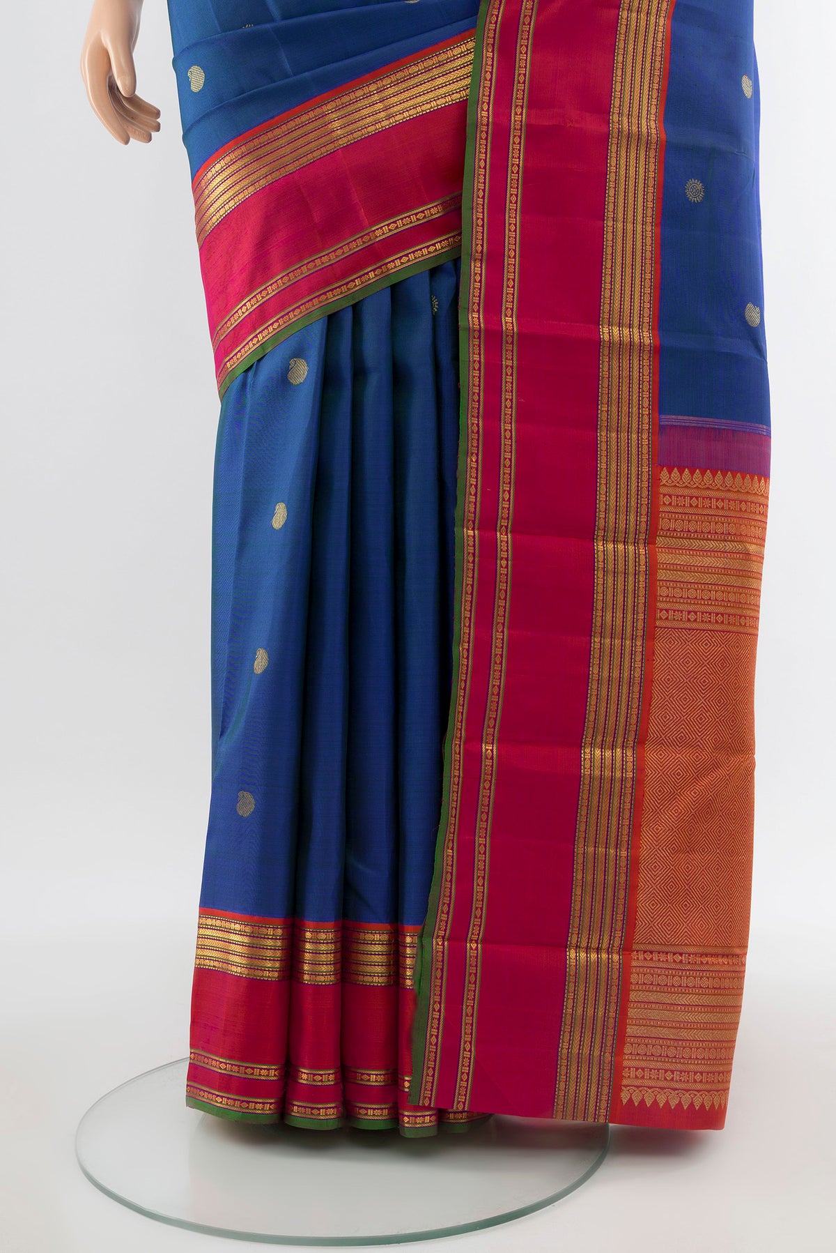Pleats and pallu of Pure Silk Pure Zari Peacock Blue Kanchipuram Saree with Zari Butta on the body and Silk Border. 