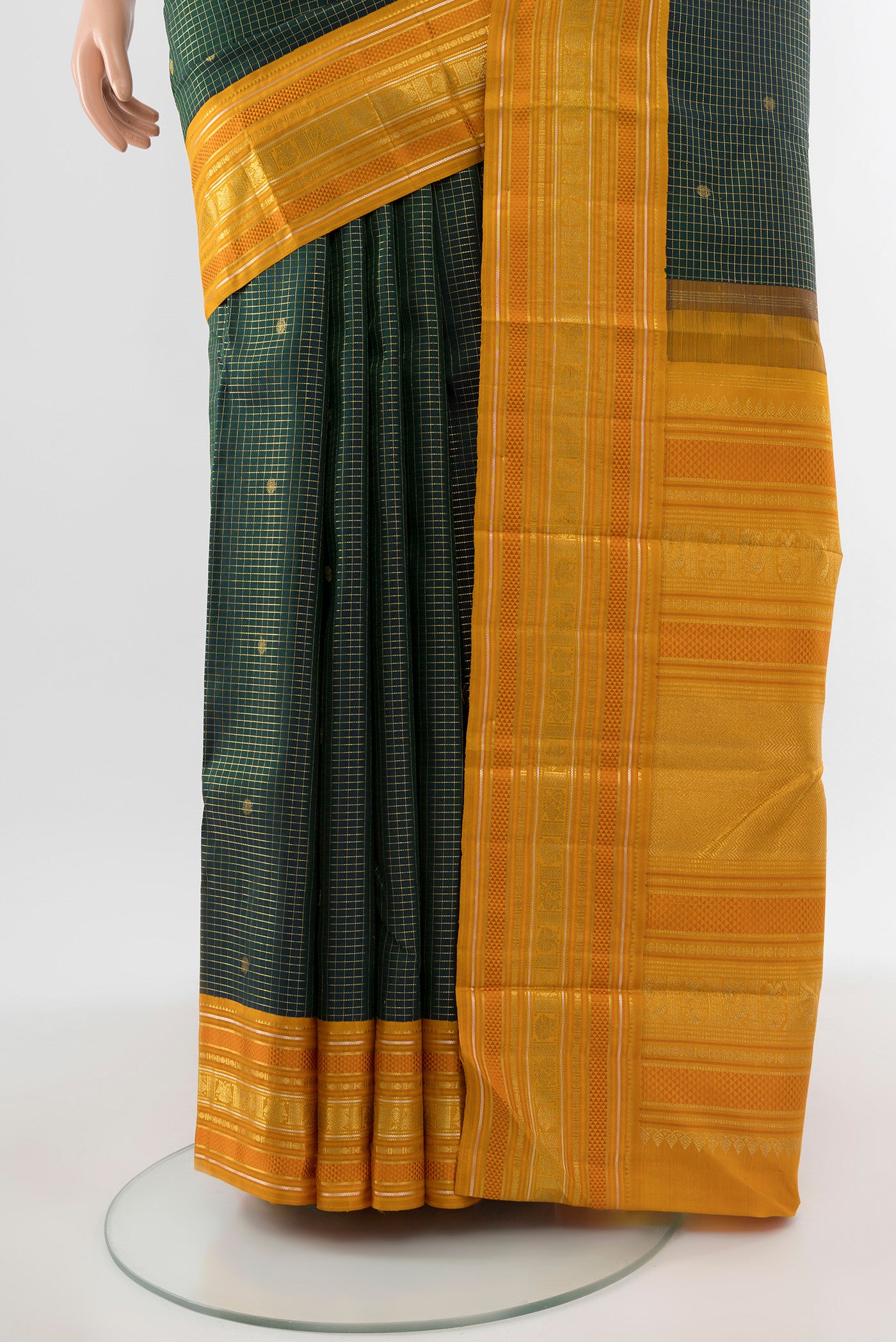 Pleats and pallu of Pure Silk Pure Zari Bottle Green Kanjivaram Saree with Zari Butta on the body and Silk Border. 