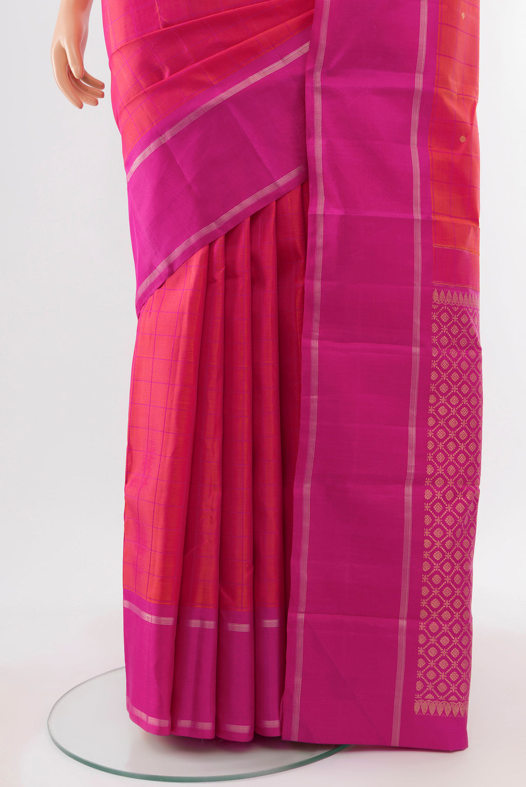 Pleats and pallu of Pure Silk Pure Zari Peach Kanchipuram Saree with Zari Butta on the body and Silk Border. 