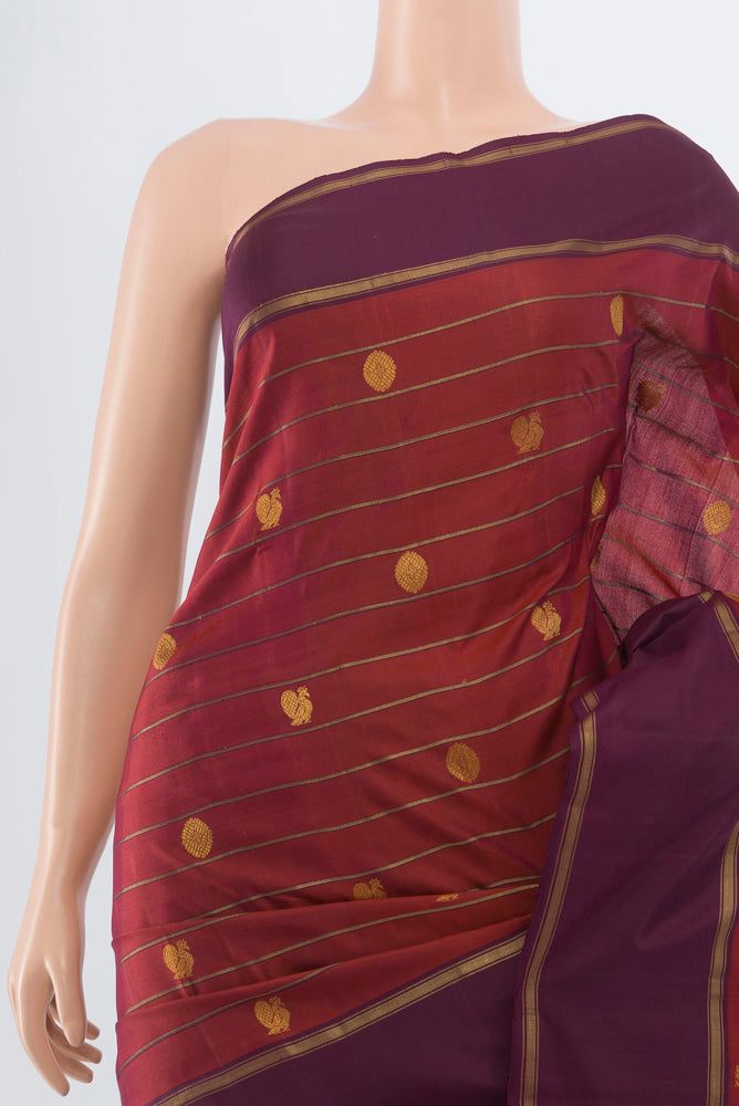 Border image of Maroon Kanchipuram Silk Saree with Zari Butta on the body and Silk Border. 