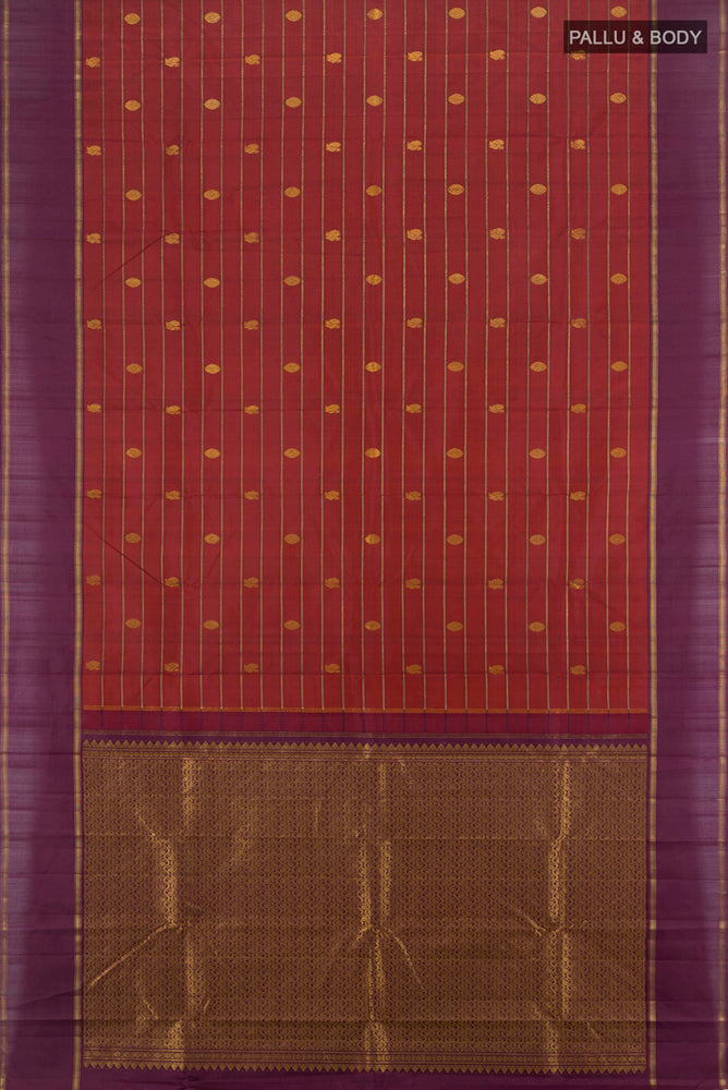 Flat view of Maroon Kanchipuram Silk Saree with Zari Butta on the body and Silk Border. 