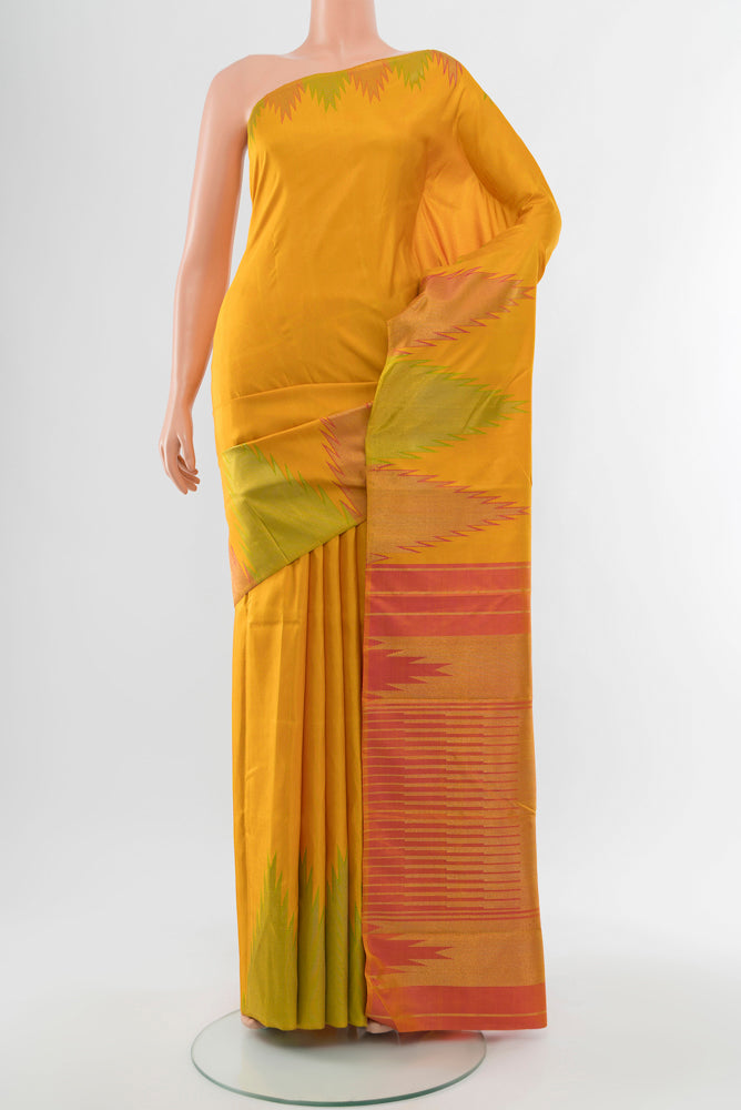 Yellow Kanjivaram Silk Saree with Zari Butta on the body and Silk Border.  displayed on a mannequin