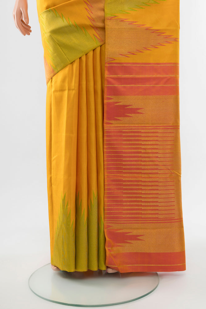 Pleats and pallu of Yellow Kanjivaram Silk Saree with Zari Butta on the body and Silk Border. 