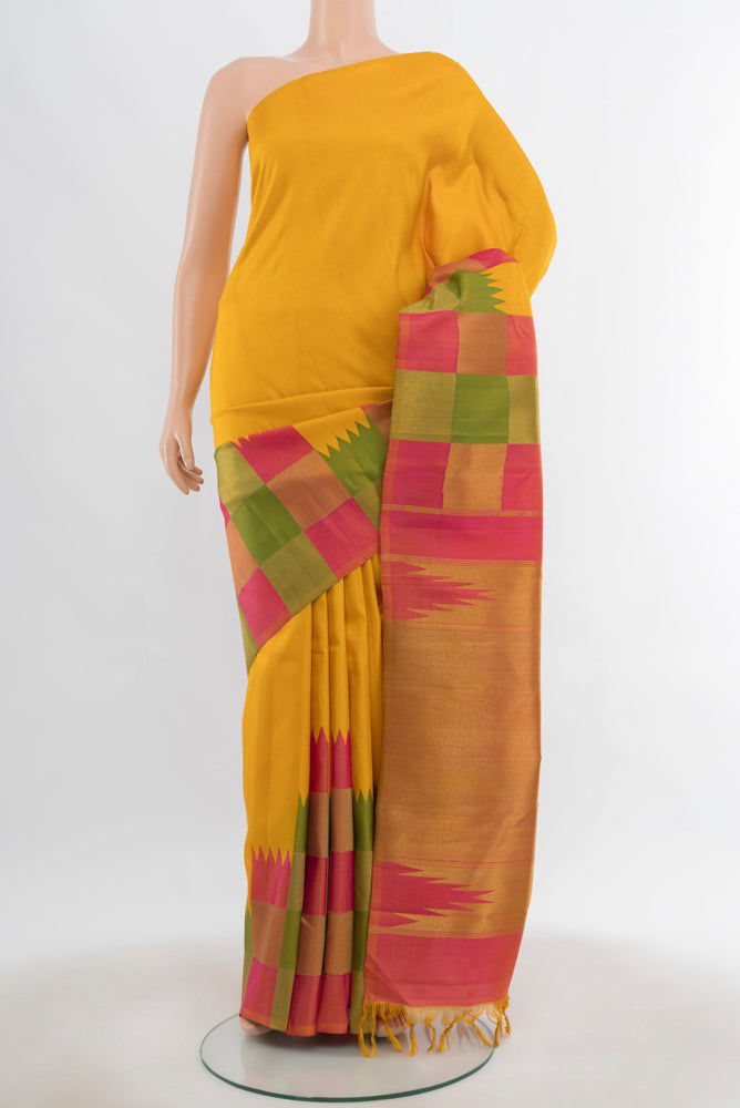 Multi Color Kanjivaram Silk Saree with Zari Butta on the body and Silk Border.  displayed on a mannequin