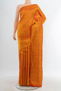 Brick Orange Kanchipuram Silk Saree with Zari Brocade on the body and Zari Border.  displayed on a mannequin