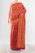 Peach Kanchipuram Silk Saree with Zari Brocade on the body and Silk Border.  displayed on a mannequin