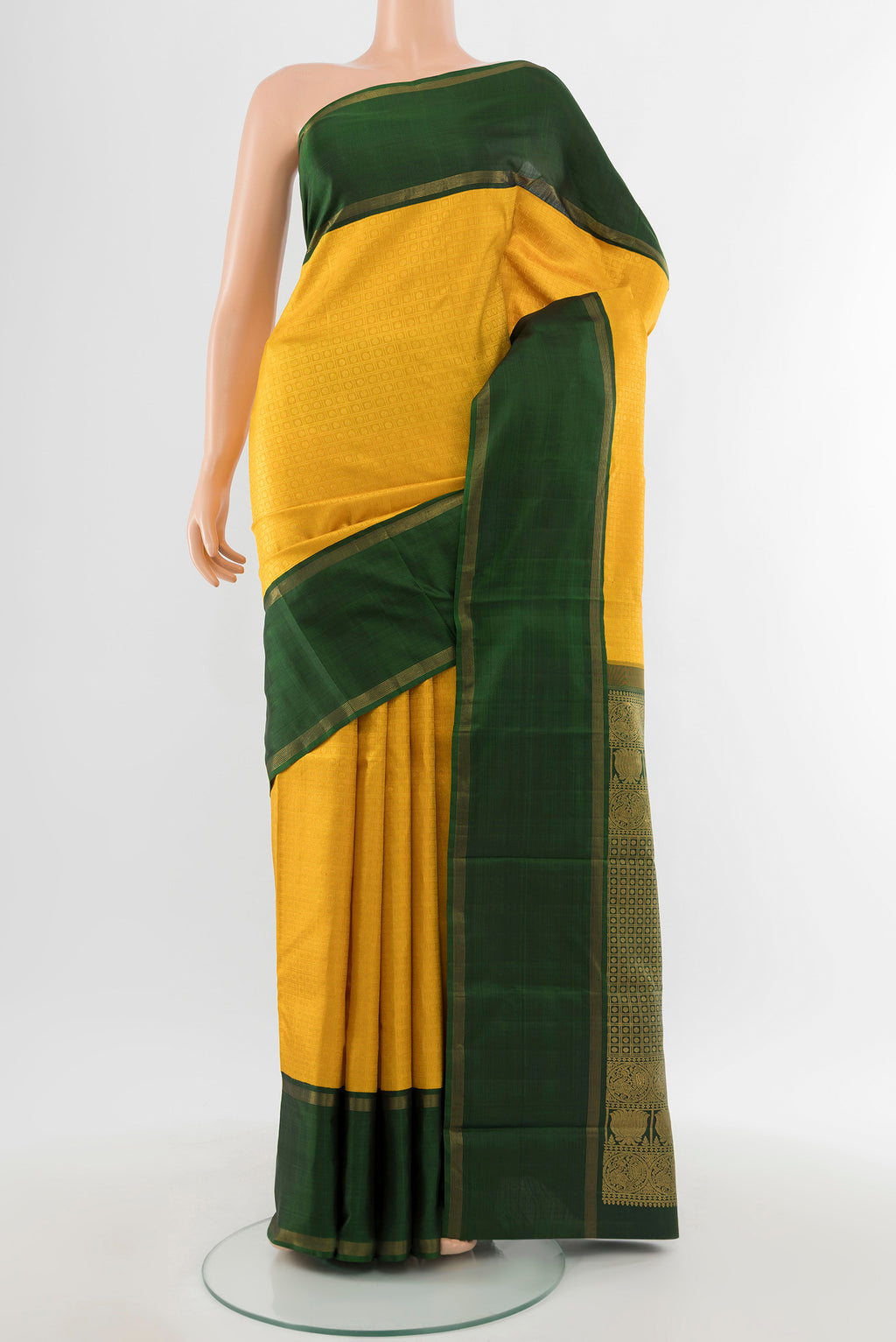 Pure Silk Pure Zari Yellow Kanchipuram Saree with Zari Butta on the body and Silk Border.  displayed on a mannequin