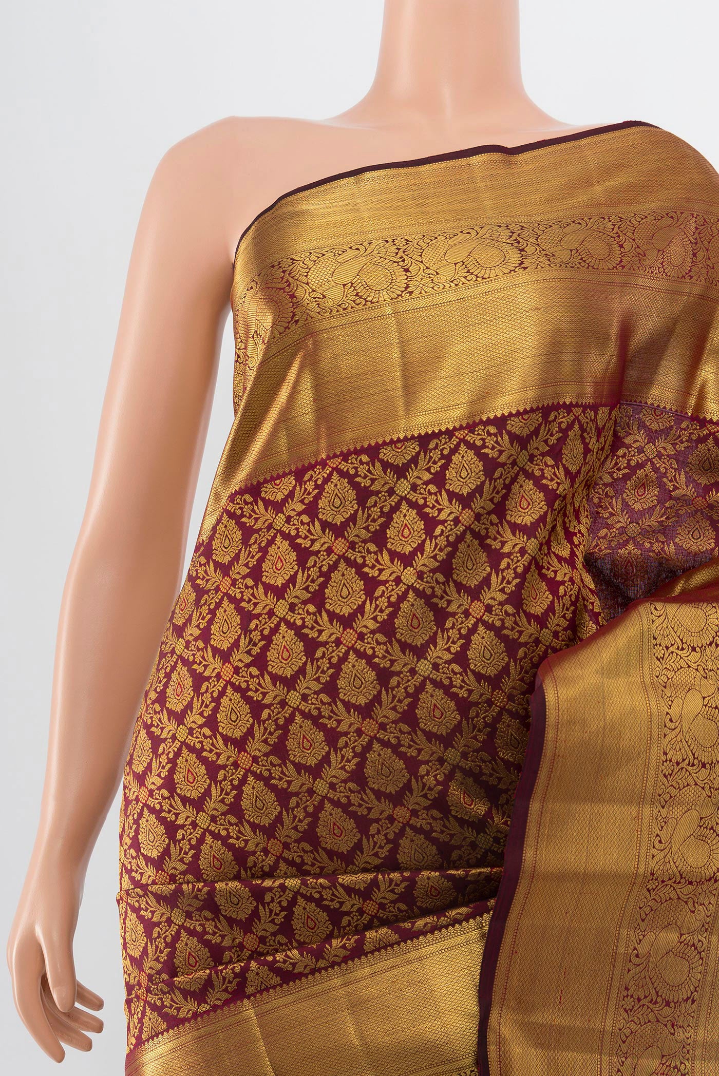 Border image of Pure Silk Pure Zari Maroon Kanchipuram Saree with Zari Butta on the body and Silk Border. 