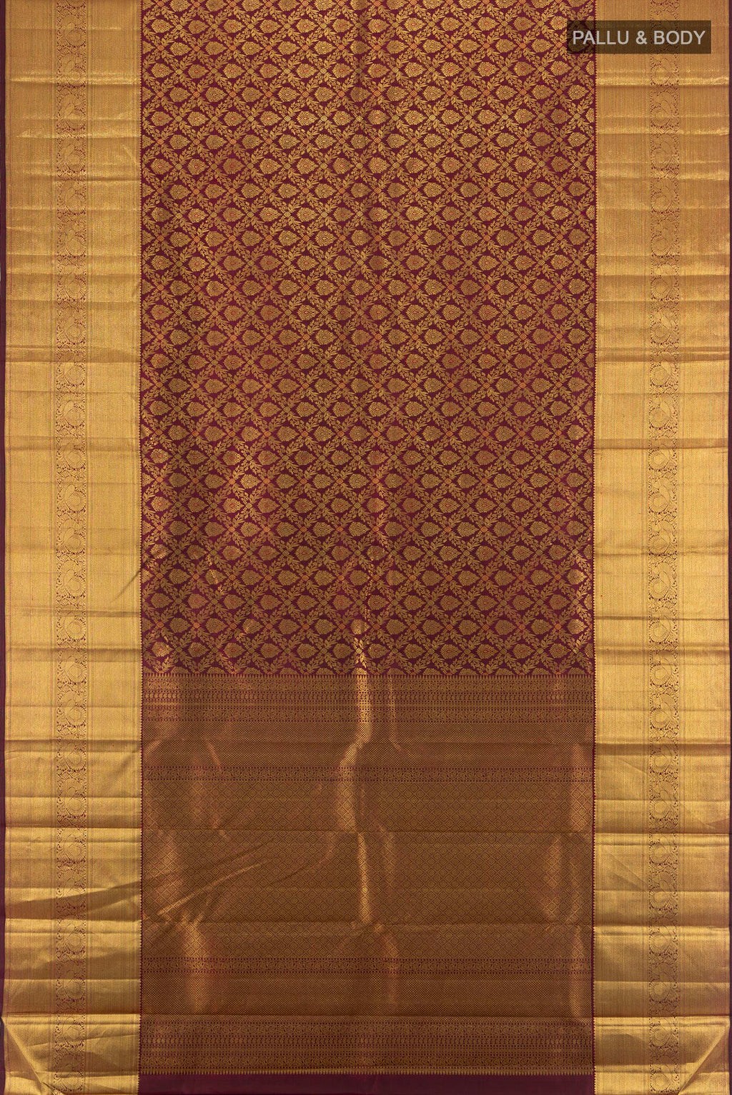 Flat view of Pure Silk Pure Zari Maroon Kanchipuram Saree with Zari Butta on the body and Silk Border. 