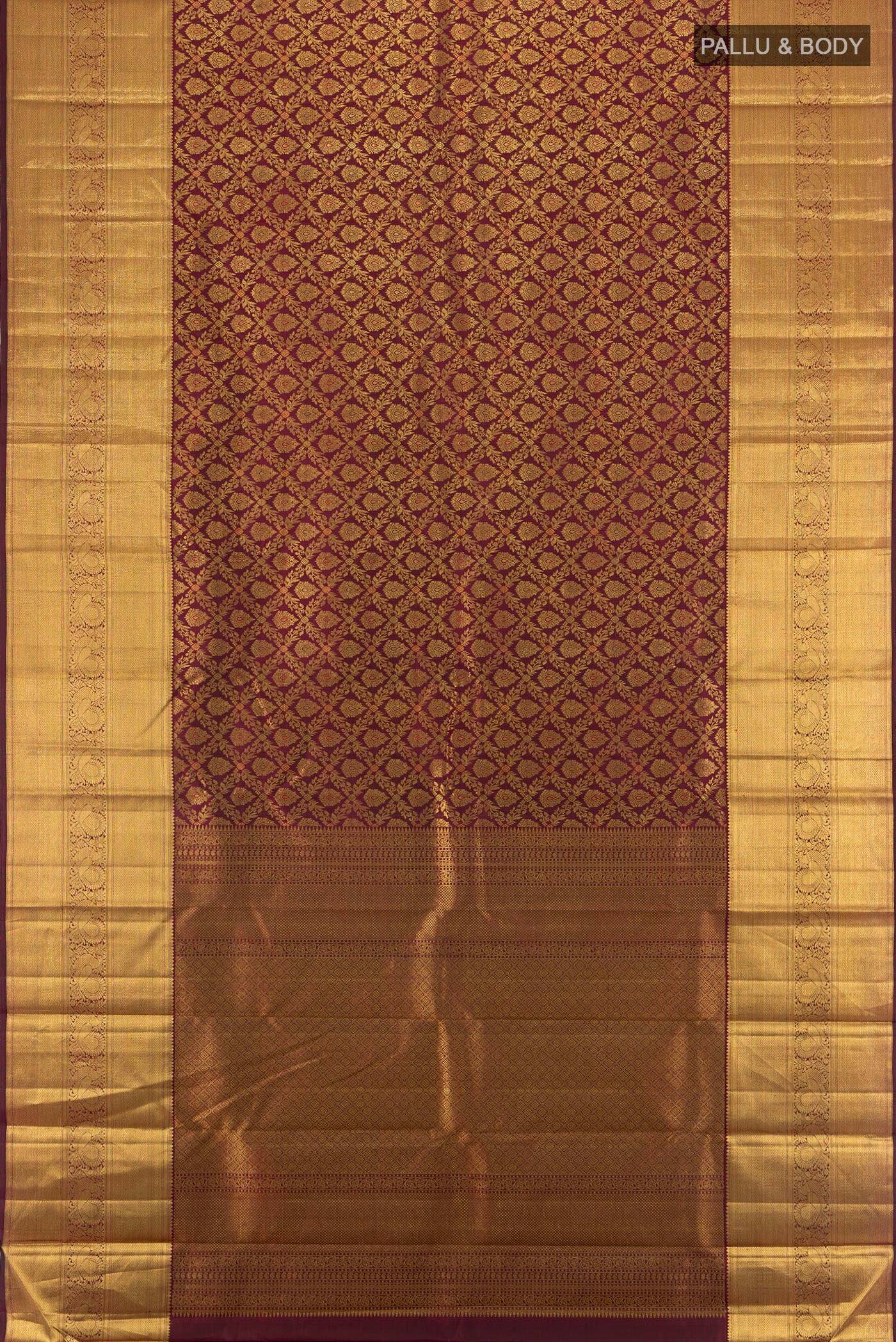 Flat view of Pure Silk Pure Zari Maroon Kanchipuram Saree with Zari Butta on the body and Silk Border. 