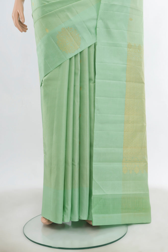 Pleats and pallu of Pista Green Kanchipuram Silk Saree with Zari Butta on the body and Fancy Border. 