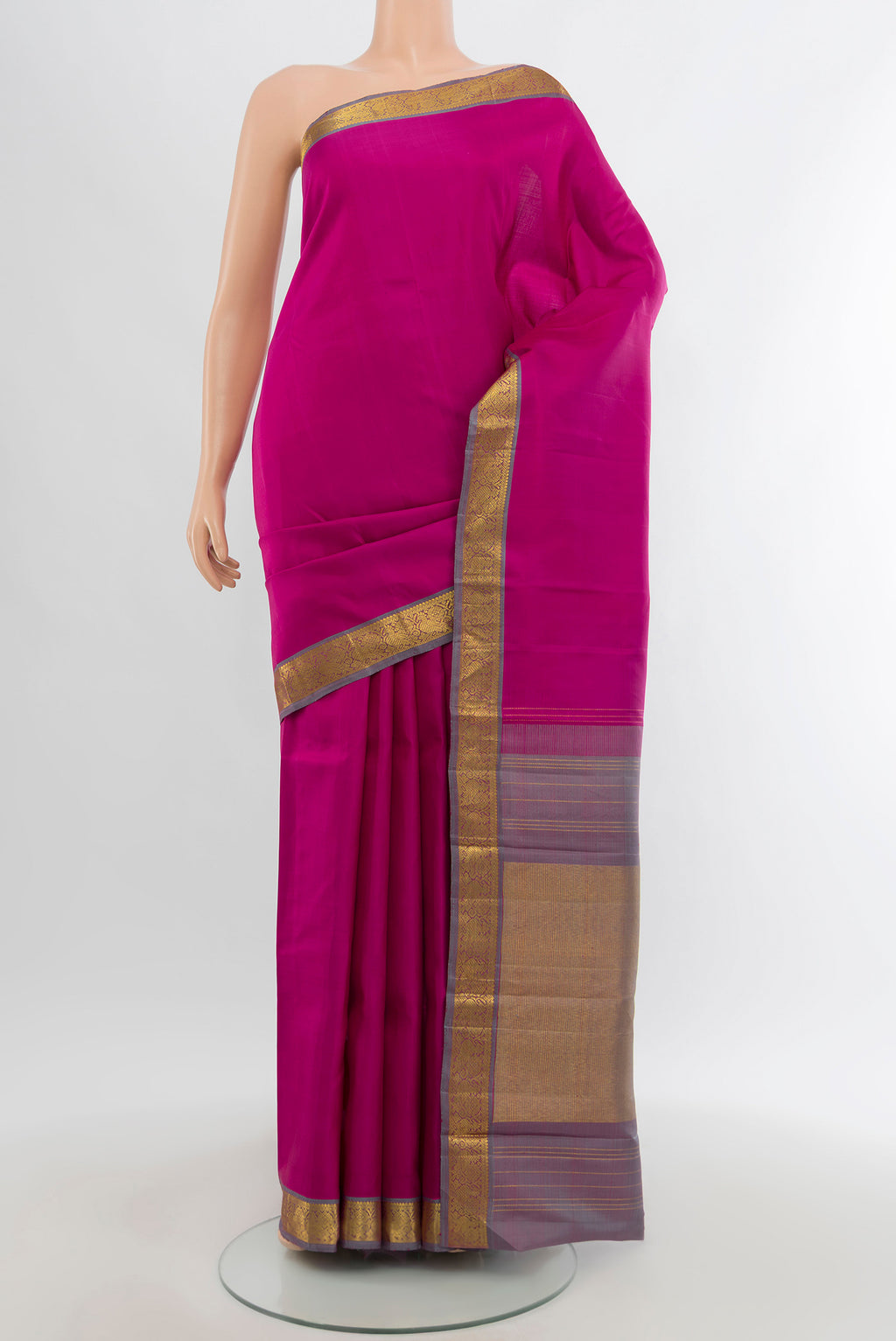 Rani Pink Kanchipuram Silk Saree with Zari Butta on the body and Zari Border.  displayed on a mannequin