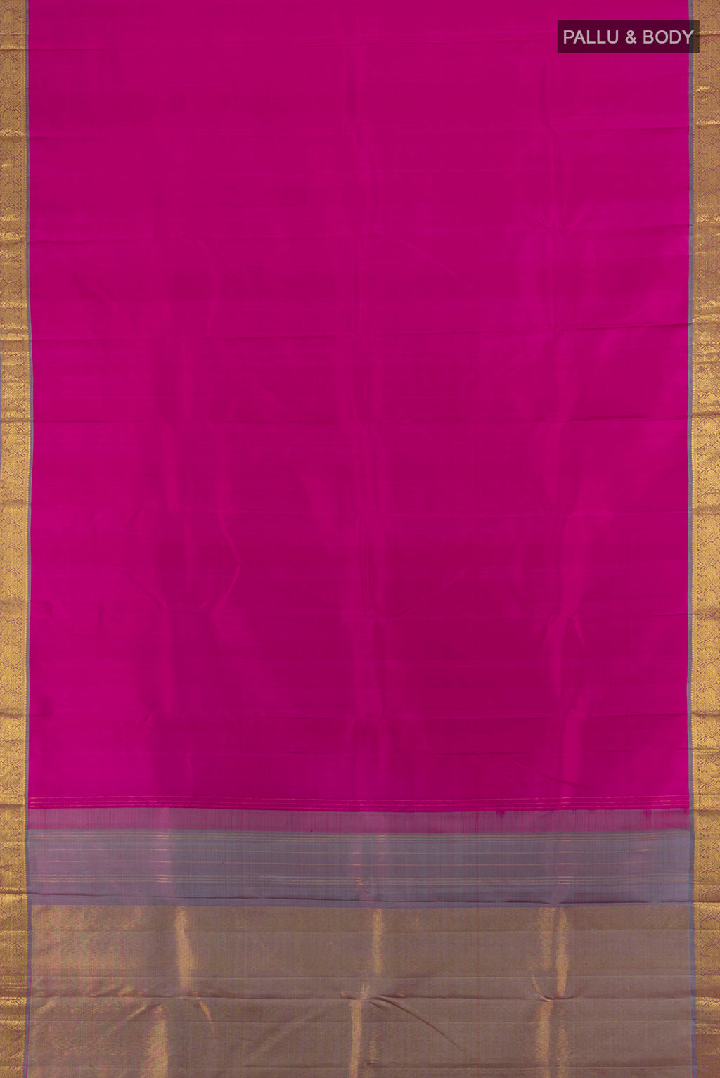 Flat view of Rani Pink Kanchipuram Silk Saree with Zari Butta on the body and Zari Border. 