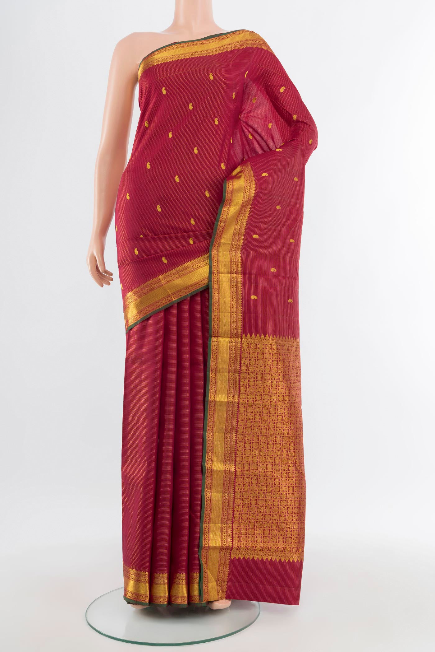 Pure Silk Pure Zari Maroon Kanjivaram Saree with Zari Butta on the body and Zari Border.  displayed on a mannequin
