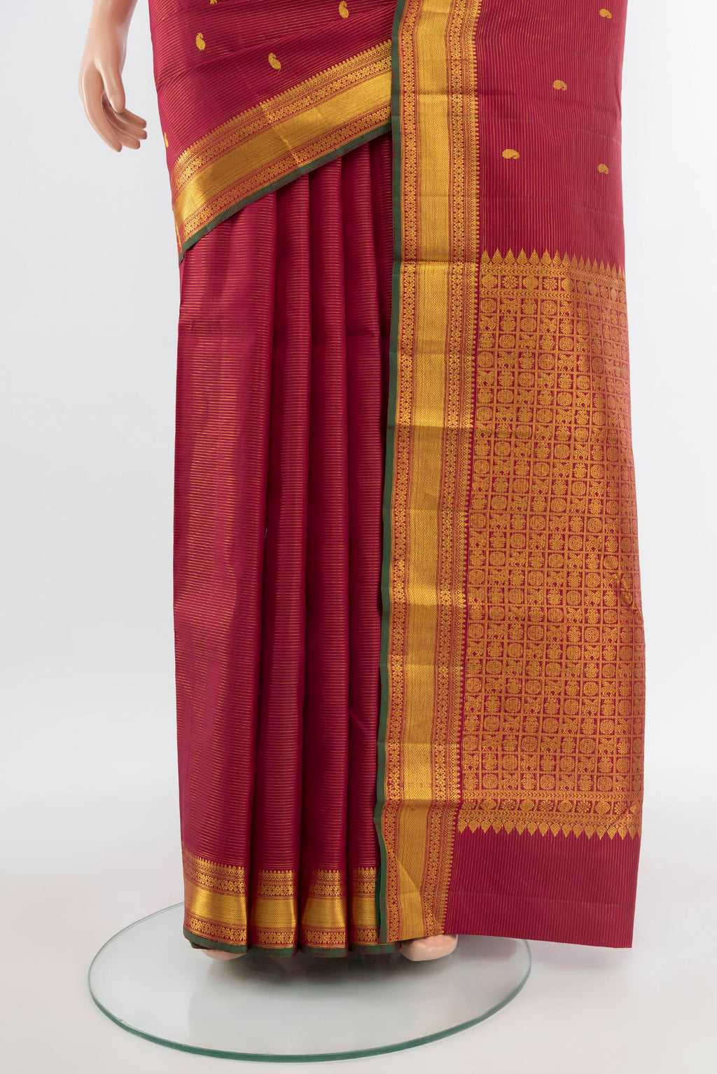 Pleats and pallu of Pure Silk Pure Zari Maroon Kanjivaram Saree with Zari Butta on the body and Zari Border. 