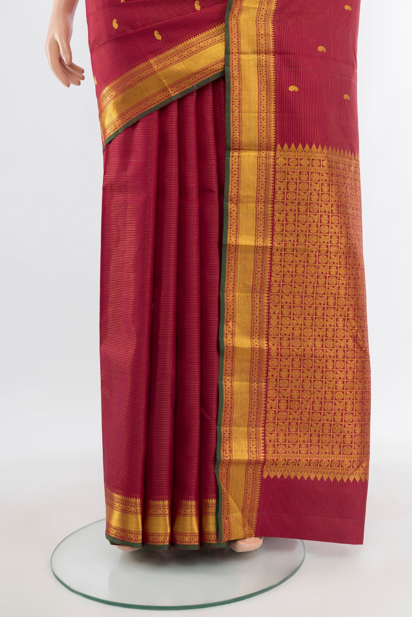 Pleats and pallu of Pure Silk Pure Zari Maroon Kanjivaram Saree with Zari Butta on the body and Zari Border. 